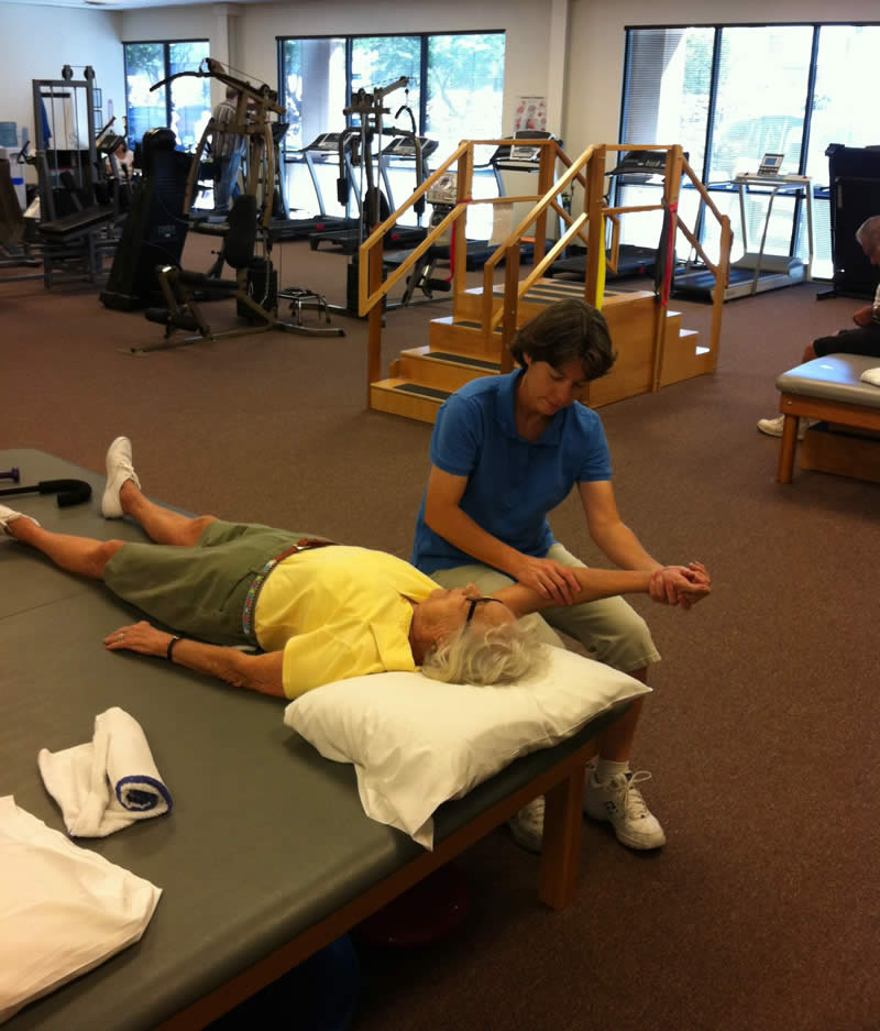 Physical Therapist, Lori Linville-Petrik, working with a patient at Paragon Physical Therapy and Rehab in Bullhead City
